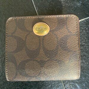 Signature Coach dark brown small wallet with round Coach metal plaque snap close